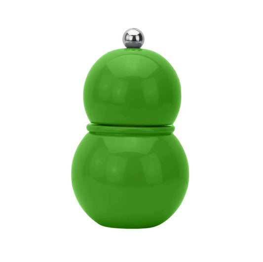 liten kryddkvarn grön mot vit bakgrund