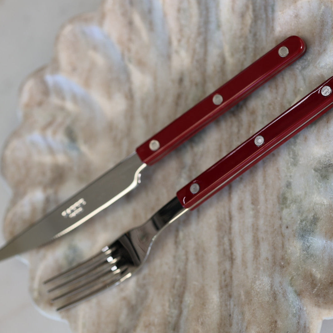Set di posate Sabre Paris da 24 pezzi, colore bordeaux.